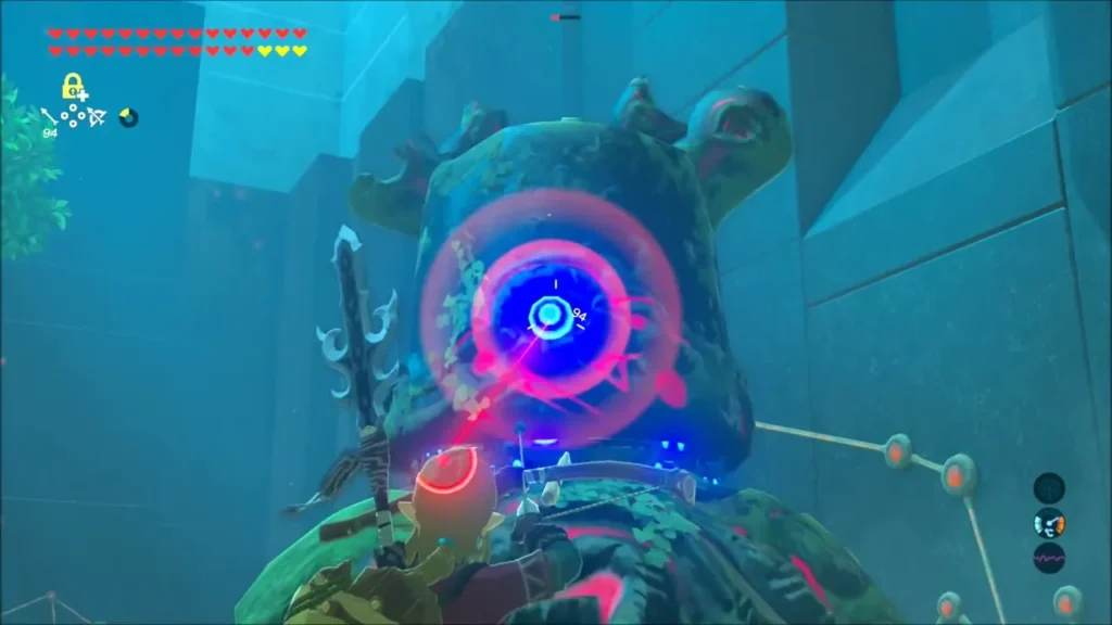 Link aiming at a Decayed Guardian's glowing eye from close range Link aiming at a Decayed Guardian's glowing eye from close range
