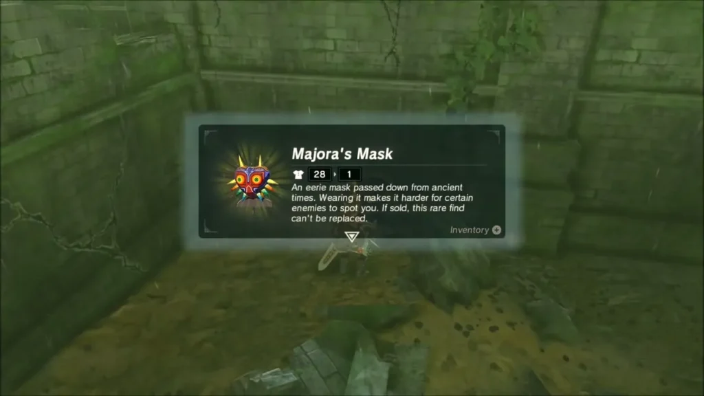 Link receiving Majora's Mask, with its description box on screen Link receiving Majora's Mask, with its description box on screen