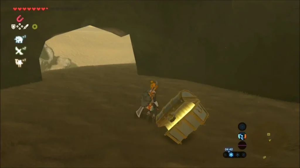 Link beside the chest in the cave after pulling it free of the dunes Link beside the chest in the cave after pulling it free of the dunes