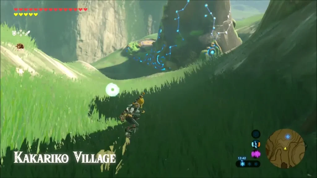 Link sliding down the grassy slope toward Kakariko Village Link sliding down the grassy slope toward Kakariko Village