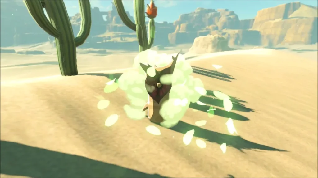 Korok bursting out in a cloud of leaves beside a cactus on a desert dune Korok bursting out in a cloud of leaves beside a cactus on a desert dune