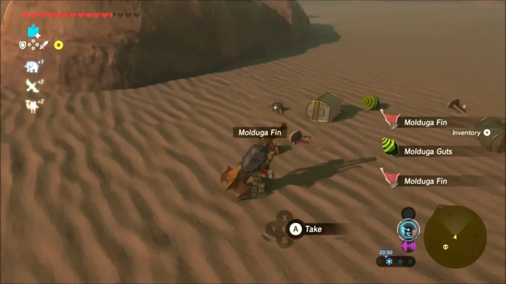 Molduga Fin and Molduga Guts dropped on the sand beside a chest Molduga Fin and Molduga Guts dropped on the sand beside a chest