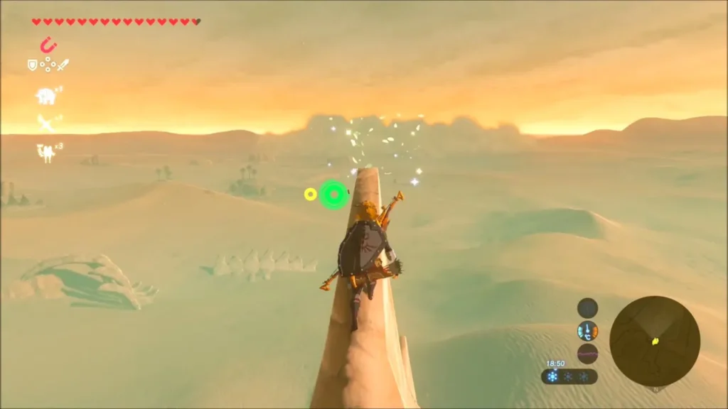 Link climbing the narrow rock spire above the dunes Link climbing the narrow rock spire above the dunes