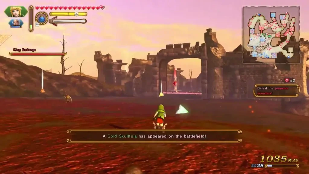 A Gold Skulltula has appeared on the battlefield message on a red-earth field beside a ruined gate A Gold Skulltula has appeared on the battlefield message on a red-earth field beside a ruined gate