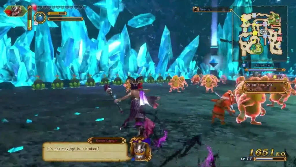 Cia swings her staff at Goron-side enemies in a glowing blue crystal cave Cia swings her staff at Goron-side enemies in a glowing blue crystal cave