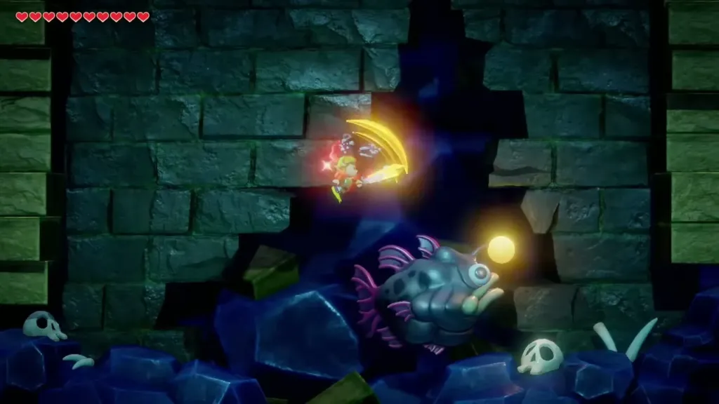 Link swimming above the Angler Fish and slashing its glowing lure Link swimming above the Angler Fish and slashing its glowing lure