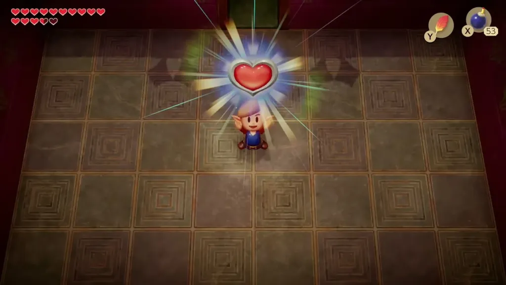Link holding up the Heart Container with its item message box Link holding up the Heart Container with its item message box