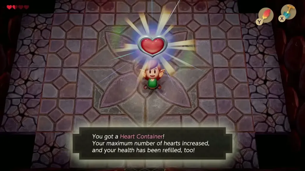 Link holding up the Heart Container with the item message box shown in full Link holding up the Heart Container with the item message box shown in full
