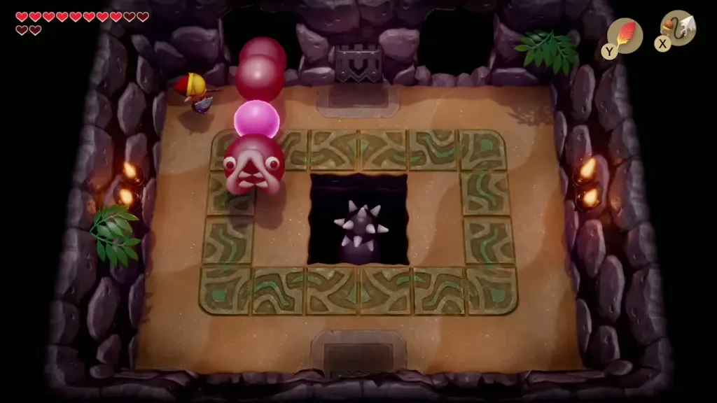 Link grabbing the Slime Eel's glowing pink head from the wall hole Link grabbing the Slime Eel's glowing pink head from the wall hole