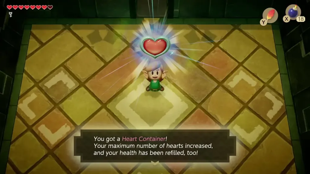 Link holding up the Heart Container with the item message box shown in full Link holding up the Heart Container with the item message box shown in full