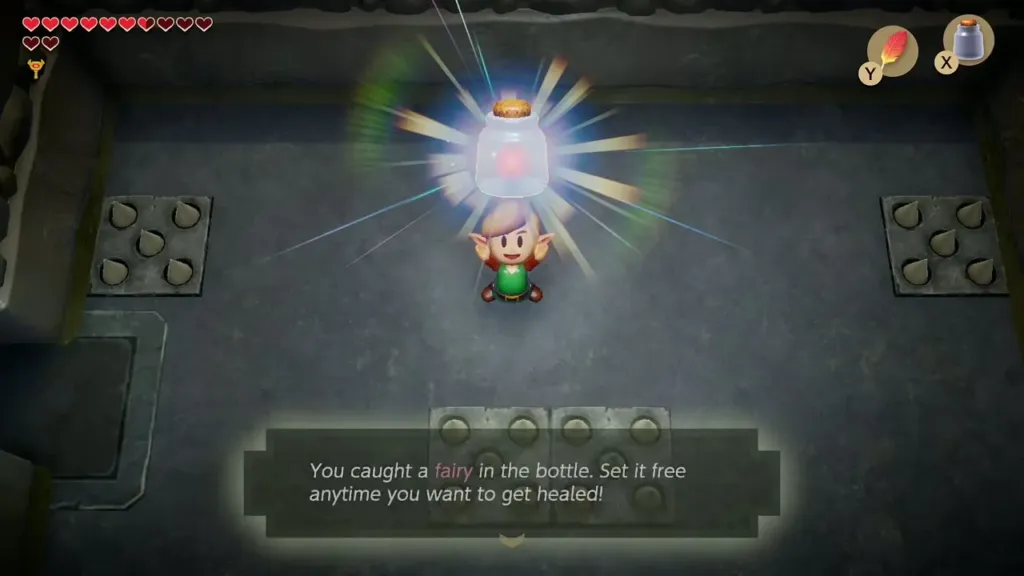 Link holding up a fairy in a bottle with the text box saying he caught it