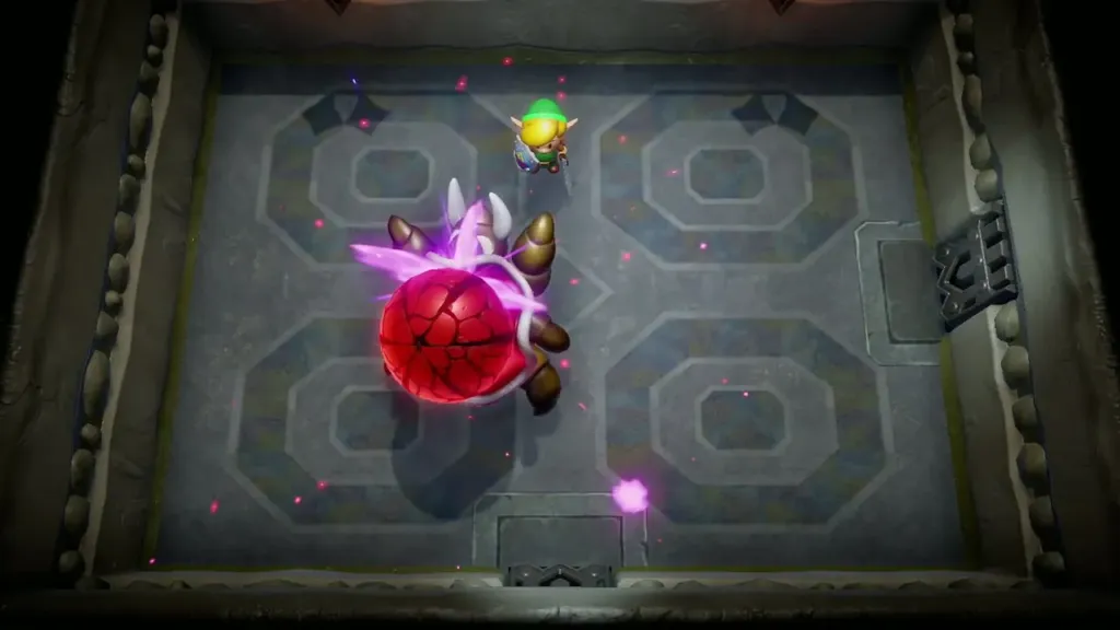 The Hardhit Beetle's red shell bursting in a purple flash as Link finishes it