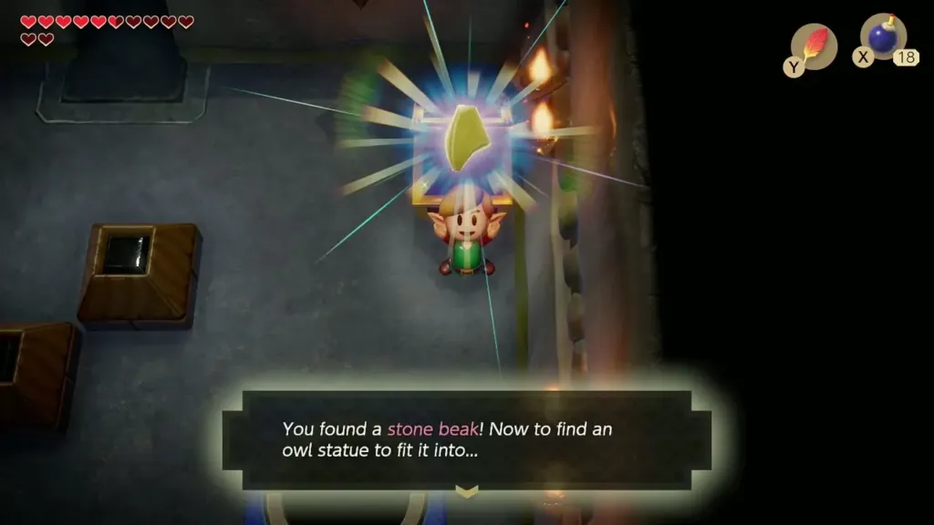 Link holding up the Stone Beak with the text box saying he found it
