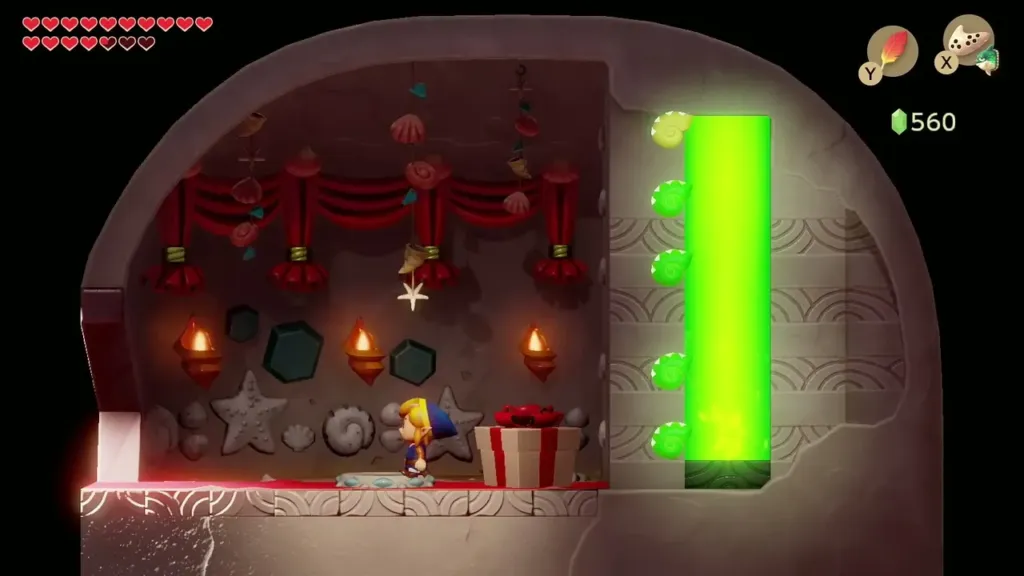An opened gift box and rupees beside Link in the Seashell Mansion An opened gift box and rupees beside Link in the Seashell Mansion