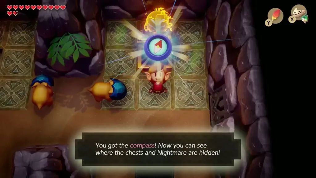 Link holding up the Compass with its message box in Catfish's Maw
