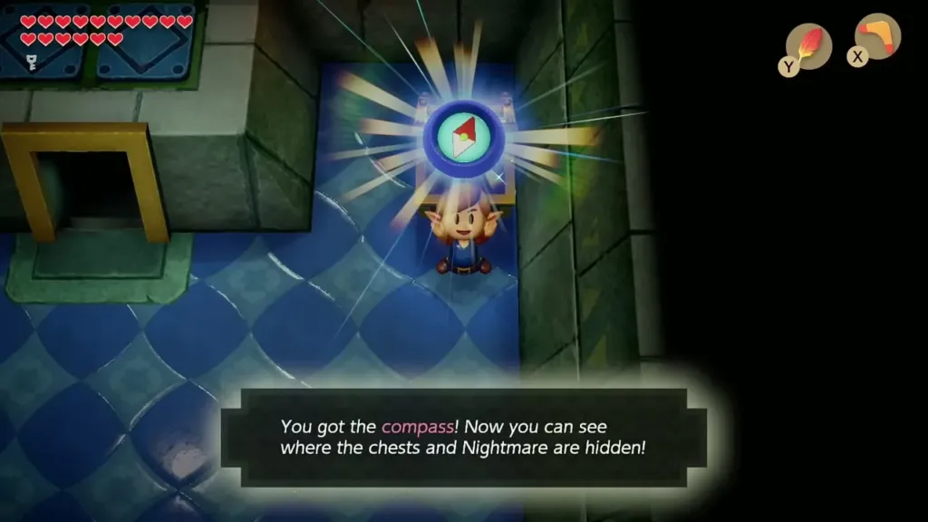 Link holding up the Compass with its message box in Eagle's Tower