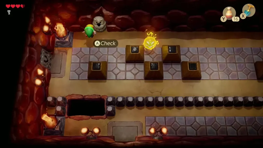 Link standing at the owl statue in a Tail Cave block room