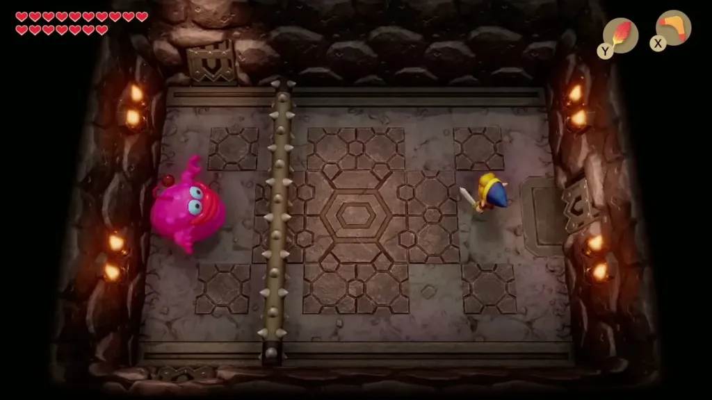 Link facing a pink Vacuum Mouth beside a spiked bar in Turtle Rock