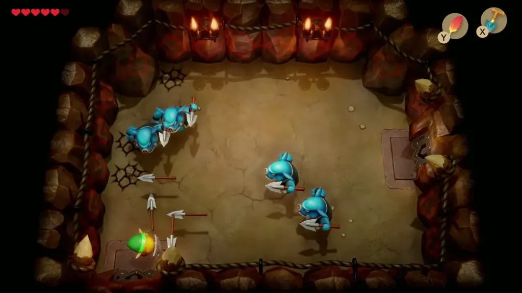 Link dodging spears from blue Moblins in the Moblin cave Link dodging spears from blue Moblins in the Moblin cave