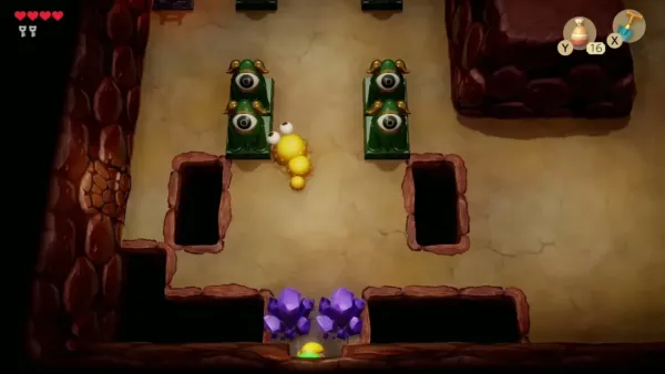 Link entering a Tail Cave room with a yellow caterpillar between the eye statues Link entering a Tail Cave room with a yellow caterpillar between the eye statues