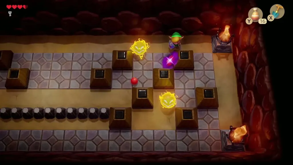 Link facing two Spark enemies along the tiled walkway in Tail Cave Link facing two Spark enemies along the tiled walkway in Tail Cave