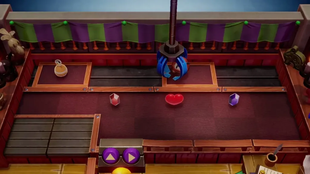 The claw gripping the Goomba figure on the prize floor The claw gripping the Goomba figure on the prize floor