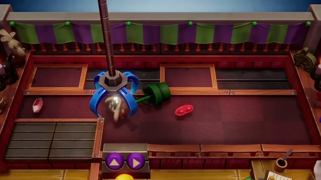 The claw lifting the Piranha Plant figure by its flower head The claw lifting the Piranha Plant figure by its flower head