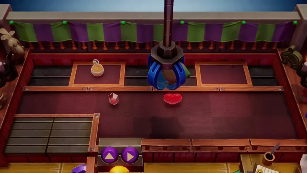 The claw lowering toward a heart prize on the second try The claw lowering toward a heart prize on the second try