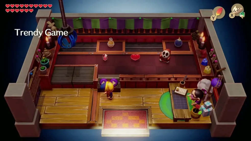 Link at the crane in the Trendy Game shop with the Shy Guy figure on the floor Link at the crane in the Trendy Game shop with the Shy Guy figure on the floor