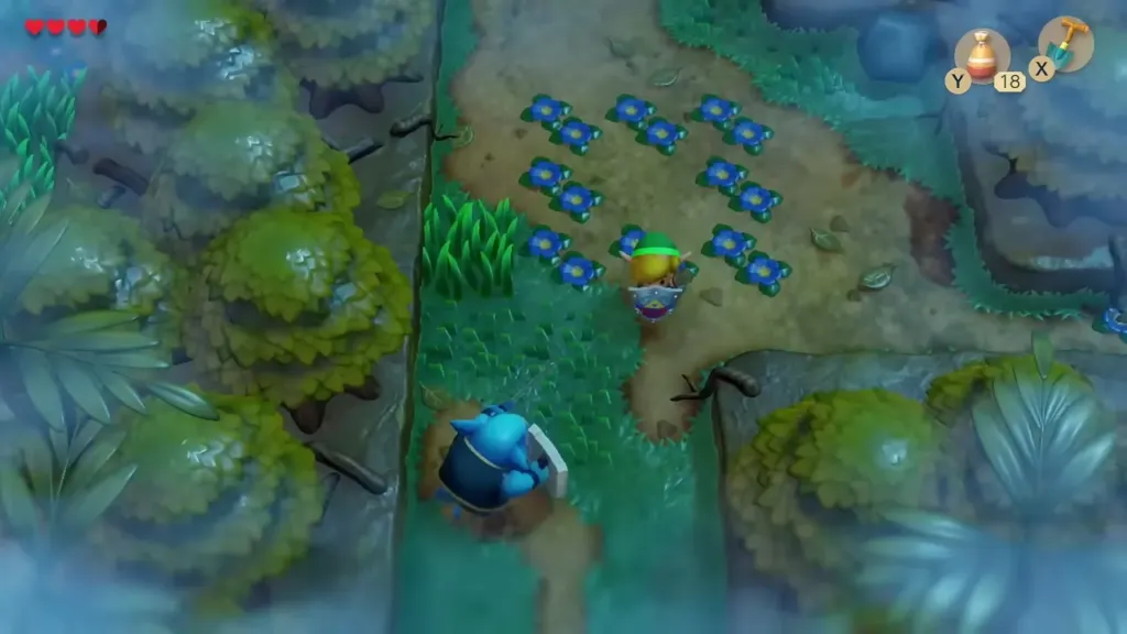 Link on the Mysterious Forest path among blue flowers with a Moblin below Link on the Mysterious Forest path among blue flowers with a Moblin below