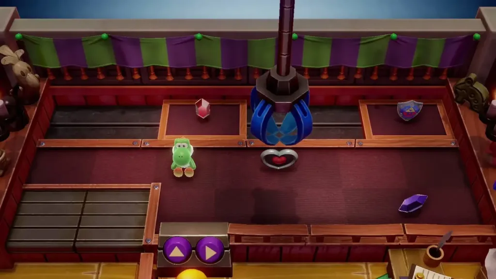 The crane claw hovering over the heart prize in the claw machine room