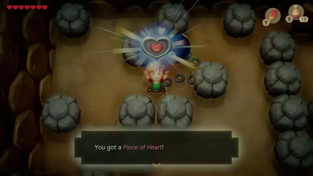 Link holding up the Piece of Heart in the rock cave, with the item message shown