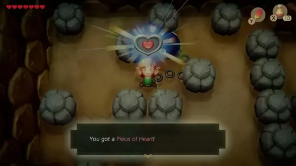 Link holding up the Piece of Heart in the rock cave, with the item message shown
