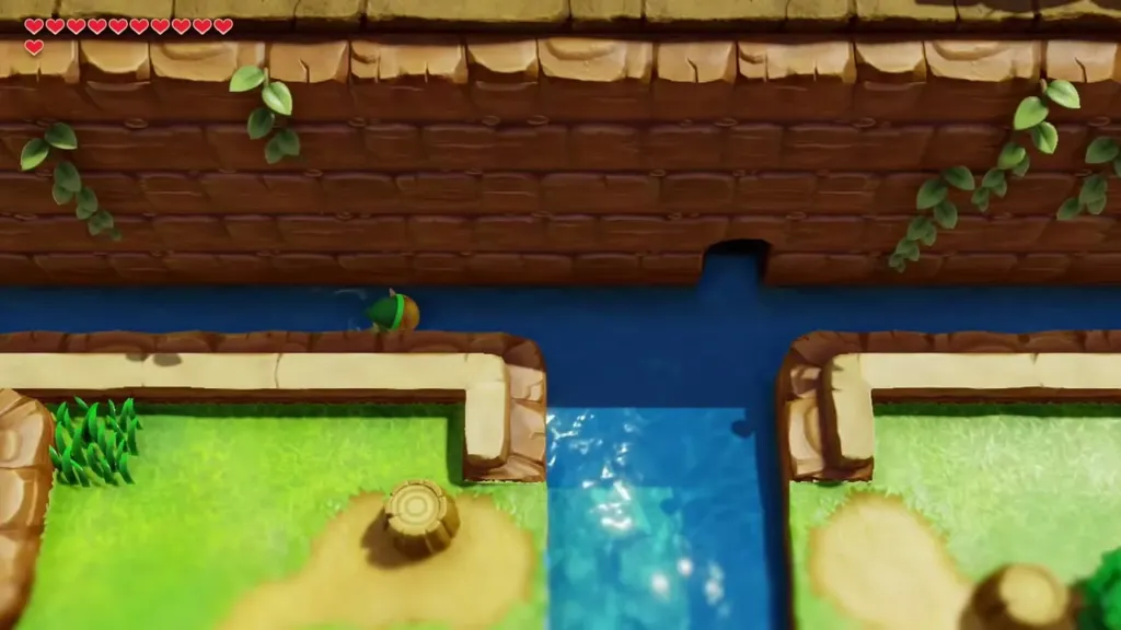 Link swimming up a channel in the Tal Tal Heights lake toward a cave opening