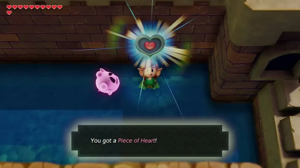 Link holding up a Piece of Heart in the moat with the item text box
