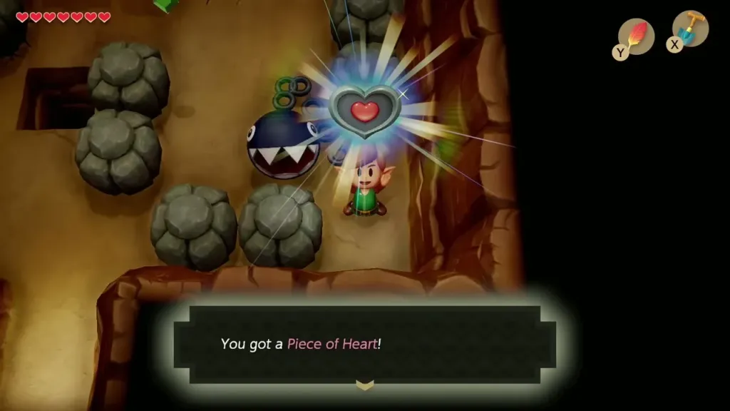 Link holding up the second Piece of Heart, with the item message shown