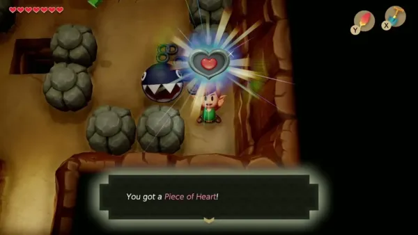 Link holding up the second Piece of Heart, with the item message shown