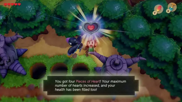 Link holding up the Piece of Heart beyond the pits with the item box