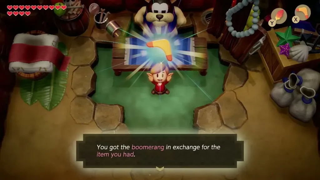 Link holding up the Boomerang with its name box in the Goriya's cave Link holding up the Boomerang with its name box in the Goriya's cave