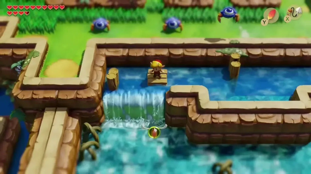 The raft at the top of a small waterfall with a rupee floating ahead The raft at the top of a small waterfall with a rupee floating ahead