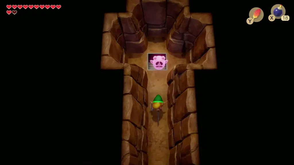 Link walking a narrow cave passage after bombing the wall Link walking a narrow cave passage after bombing the wall