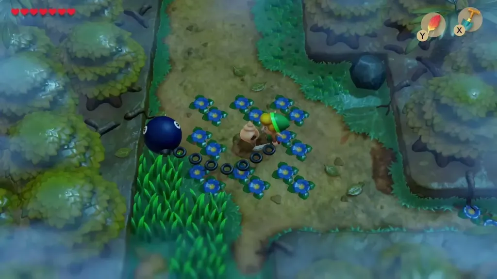 Link digging in the centre of the blue flower ring with the Shovel Link digging in the centre of the blue flower ring with the Shovel