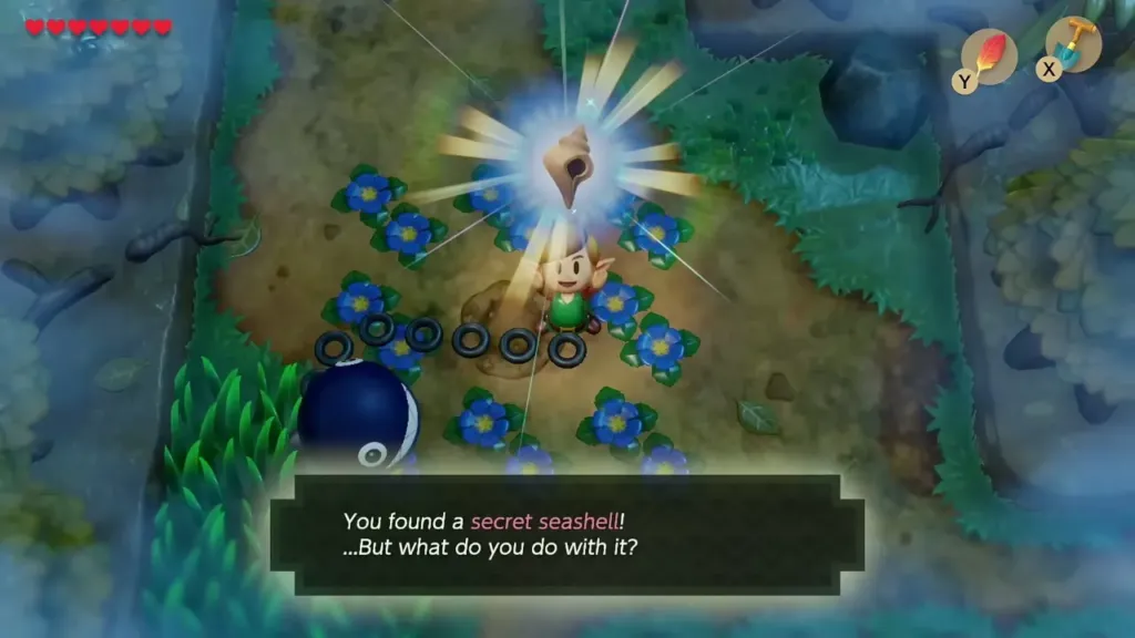 Link holding up a Secret Seashell in the flower clearing with the message box shown Link holding up a Secret Seashell in the flower clearing with the message box shown