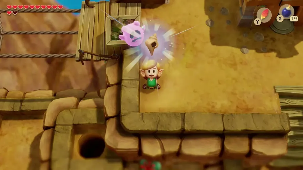 Link holding up the Secret Seashell next to the wooden bridge Link holding up the Secret Seashell next to the wooden bridge