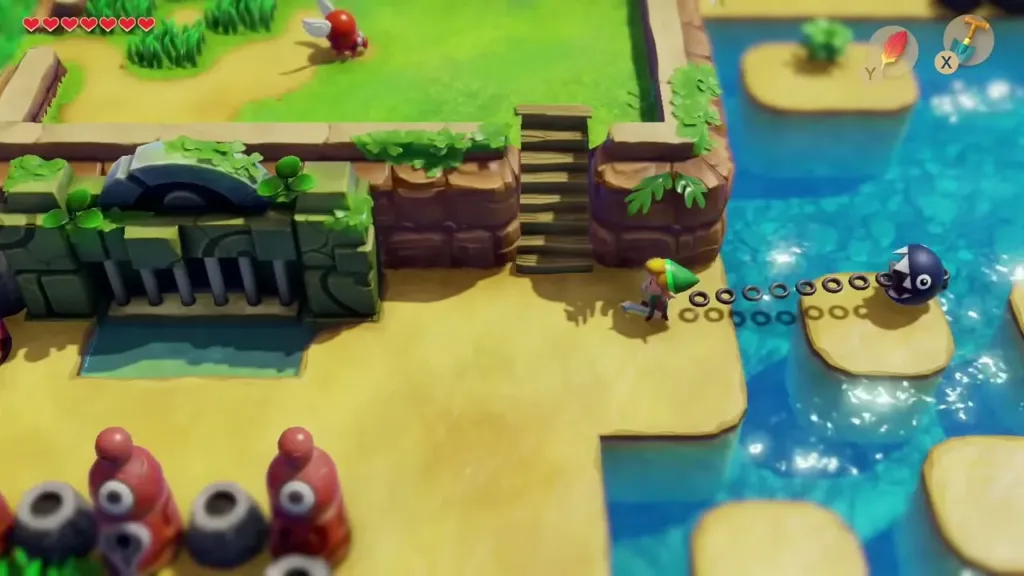 Link at the Key Cavern entrance with the red statues and the pond beside it Link at the Key Cavern entrance with the red statues and the pond beside it