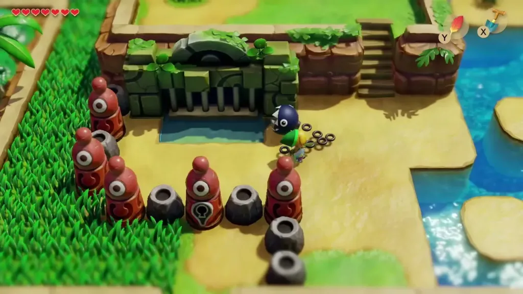 Link beside the Key Cavern gate and the row of red statues Link beside the Key Cavern gate and the row of red statues