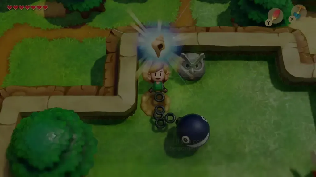 Link holding up the Secret Seashell dug up left of the Owl Statue Link holding up the Secret Seashell dug up left of the Owl Statue