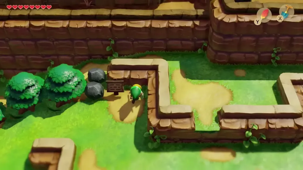 Link standing beside the wooden sign with two rocks next to it Link standing beside the wooden sign with two rocks next to it