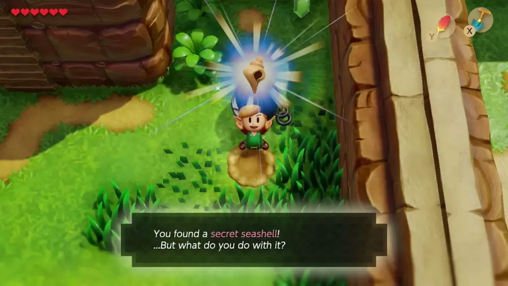 Link holding up the Secret Seashell with the item message shown Link holding up the Secret Seashell with the item message shown
