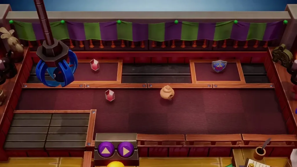 Trendy Game crane claw above the prizes on the red floor Trendy Game crane claw above the prizes on the red floor